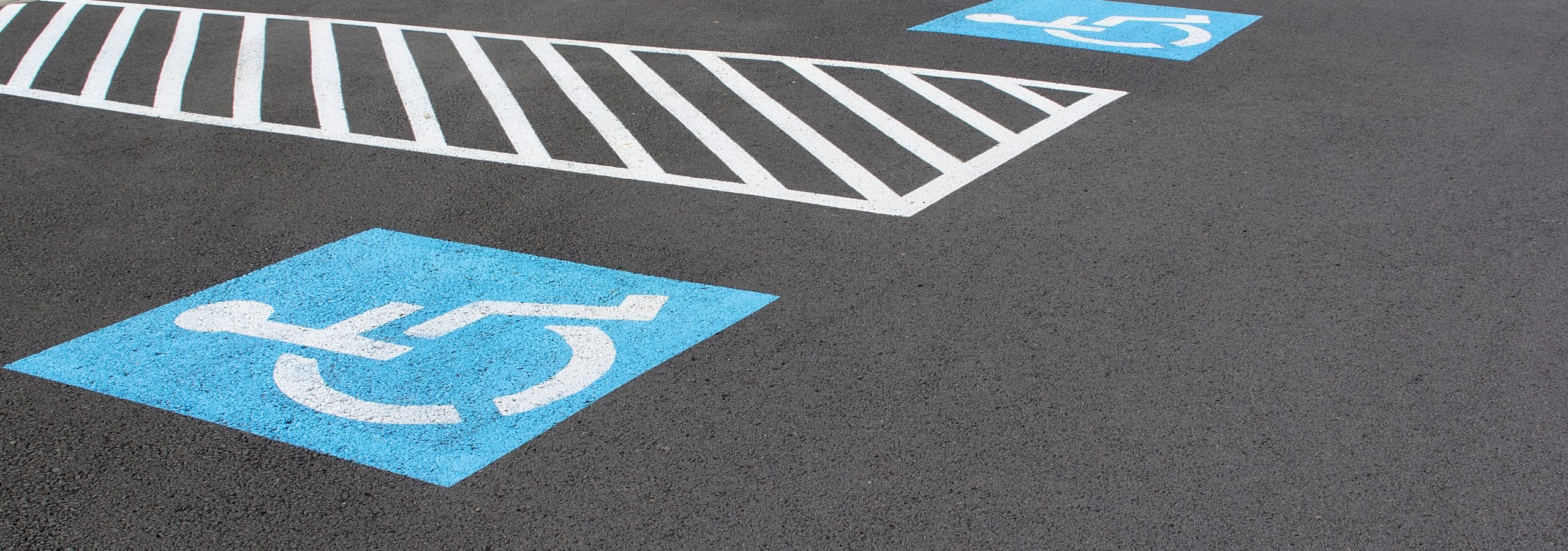 Row of handicapped parking spaces, open and available for permitted vehicles