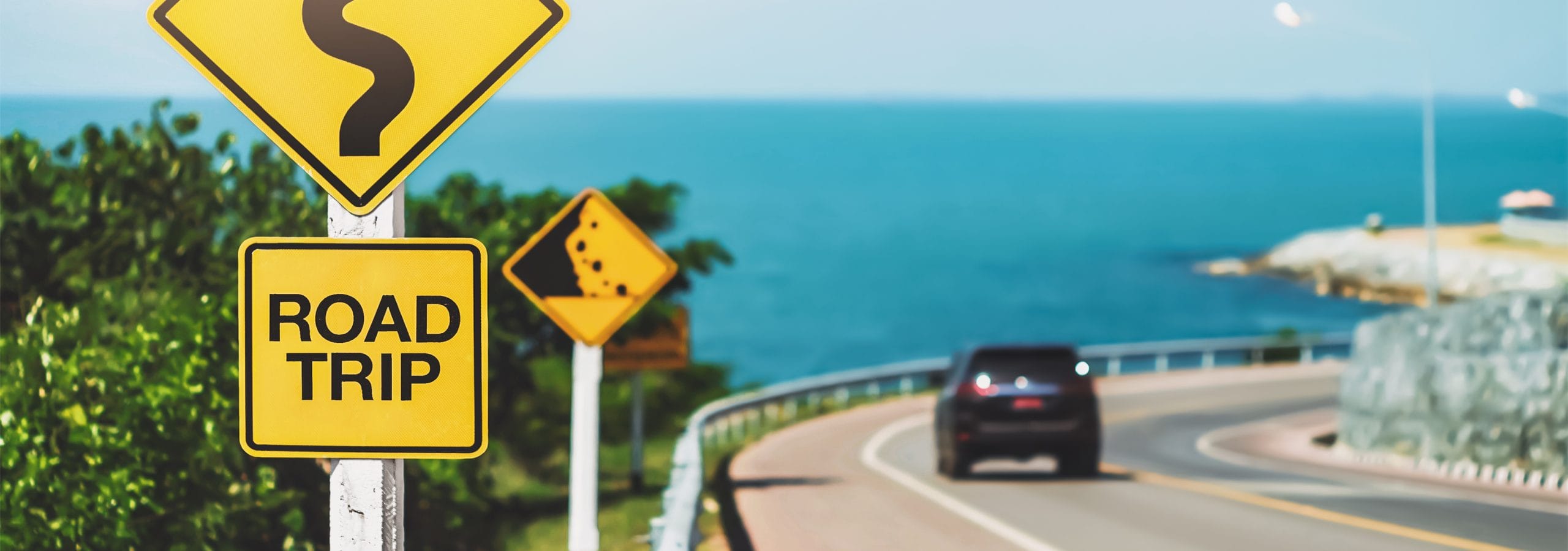 Car driving along costal highway.